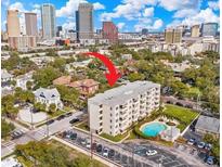 A view of the apartments including a swimming pool in front of the building at 406 W Azeele St # 103, Tampa, FL 33606