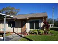 Charming single-story home features a well-manicured lawn and inviting entryway at 104 Gloucester Blvd # 340, Sun City Center, FL 33573