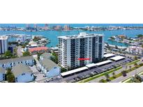 High-rise condo building with covered parking and bay views in a waterfront neighborhood at 400 Island Way # 612, Clearwater Beach, FL 33767