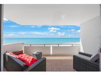 Relaxing balcony featuring comfortable seating with stunning ocean views at 17920 Gulf Blvd # 1103, Redington Shores, FL 33708