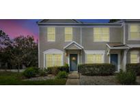 Exterior shot of townhomes with neat front yard landscaping at 2352 Lake Woodberry Cir, Brandon, FL 33510
