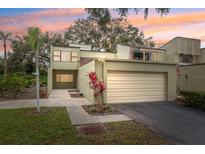 Charming two-story townhome with attached garage and vibrant landscaping at 13502 Palmwood Ln # 13502, Tampa, FL 33618