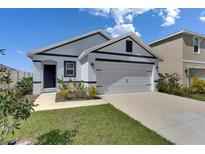 Charming single-story home with a two-car garage and well-maintained landscaping at 5617 Flagstone Trl, Palmetto, FL 34221