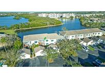 Scenic aerial view of the condo complex with waterfront views and lush landscaping at 6401 99Th N Way # 15C, St Petersburg, FL 33708