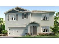 Charming two-story home showcasing a two-car garage, decorative shutters, and landscaped front yard at 3522 Thistle Bank Ct, Plant City, FL 33565