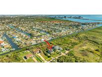Stunning aerial view showcases waterfront homes and community in a beautiful Tampa Bay setting at 4707 Troydale Rd, Tampa, FL 33615