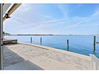 A waterfront patio with direct access to the water and views of the horizon at 673 Boca Ciega Point N Blvd, St Petersburg, FL 33708