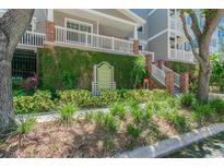 Hyde Park Walk condos with manicured landscaping and verdant ivy-covered walls for a classic Florida look at 800 S Dakota Ave # 217, Tampa, FL 33606