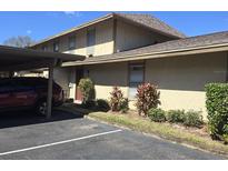 Charming condo featuring a carport, neat landscaping, and a well-maintained exterior at 852 Creekway Ct, Brandon, FL 33511
