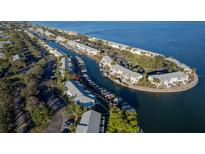 Stunning aerial view of waterfront condos with boat docks on a sunny day at 5202 Beach Se Dr # C, St Petersburg, FL 33705