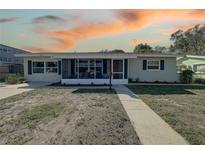 Charming single-story home with a screened-in porch and well-manicured landscaping at 4934 11Th N Ave, St Petersburg, FL 33710