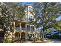 Charming three-story townhouse with balconies and well-maintained landscaping at 6030 Printery St # 108, Tampa, FL 33616