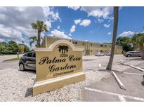 Welcoming sign for Palma Ceia Gardens Condominiums, a well-maintained community at 3206 W Azeele St # 129, Tampa, FL 33609
