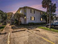 Charming two-story condo with well-kept landscaping, and assigned parking spaces at 4928 W Gandy Blvd # G203, Tampa, FL 33611
