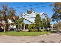 Charming two-story home with a manicured lawn and inviting front porch at 4301 W San Luis St, Tampa, FL 33629