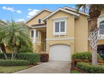 Charming two-story home with a one car garage, manicured landscaping and a cozy front porch at 15 Jefferson S Ct, St Petersburg, FL 33711