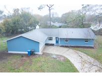 Charming single Gathering home featuring two-car garage and well manicured lawn at 20004 Harvie Ln, Lutz, FL 33558
