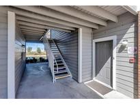 Exterior entrance featuring stairs and a gray door, offering access to the property at 1400 Gandy N Blvd # 502, St Petersburg, FL 33702