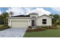 Charming single-story home with stone accents, a two-car garage, and meticulously manicured landscaping at 17053 James Trl, Parrish, FL 34219