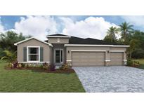 Charming single-Gathering home featuring a three-car garage and a meticulously maintained front yard at 17126 James Trl, Parrish, FL 34219