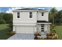 Two-story home features stone accents, a two-car garage, and a well-manicured front yard at 1824 Cobb Trl, Parrish, FL 34219