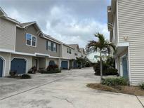 Charming townhomes with a well-maintained driveway and appealing neutral color scheme at 2900 W Azeele St # H, Tampa, FL 33609