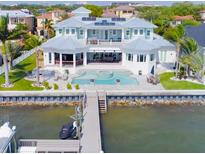 Stunning waterfront home with a private dock, a pool, and beautiful outdoor entertaining areas at 39 W Spanish Main St, Tampa, FL 33609