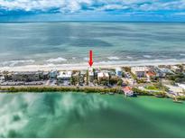 Breathtaking aerial view of beachfront property with stunning ocean views at 74 Gulf Blvd # 2B, Indian Rocks Beach, FL 33785