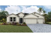 Charming single-story home with stone accents, manicured lawn, and a spacious three-car garage at 17130 James Trl, Parrish, FL 34219