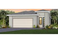 Modern home showcasing a two-car garage and decorative landscaping at 5018 Coastal Oak Ct, Lakewood Ranch, FL 34211