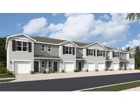 Charming two-story townhomes with attached garages and neutral gray paint at 17437 Haysack Ter, Lakewood Ranch, FL 34211