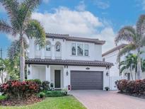 Charming two-story home with a well-manicured lawn and a spacious two-car garage at 4302 W San Pedro St, Tampa, FL 33629