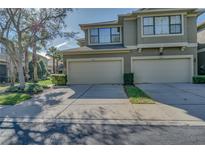 Inviting townhome with attached garages and well-maintained landscaping at 11904 10Th N Ln, St Petersburg, FL 33716