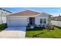 Charming single-story home with a well-maintained lawn and attached two-car garage at 35524 Quartz Lake Dr, Zephyrhills, FL 33541