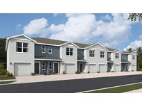 Modern townhomes feature a two-tone color scheme, individual garages, and a well-kept paved entryway at 4117 Goldheart Blvd, Bradenton, FL 34208