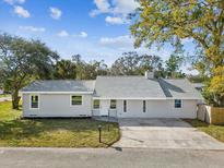 Charming single story home with a well-maintained lawn and freshly painted exterior at 2530 Sunset Dr, Largo, FL 33770