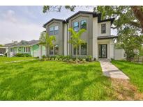 Beautifully landscaped, two story modern home with a lush green lawn and modern curb appeal at 418 W Frances Ave # 2, Tampa, FL 33602
