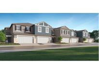 Charming townhomes featuring two-story designs, attached garages, and attractive landscaping for comfortable community living at 9344 Bonita Mar Dr, Parrish, FL 34219