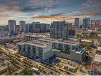 Stunning aerial view of a modern apartment complex nestled in a vibrant cityscape under a beautiful sky at 111 N 12Th St # 1314, Tampa, FL 33602