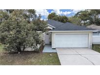 Charming single-Gathering home with a well-maintained lawn and two car garage at 6512 N 24Th St, Tampa, FL 33610