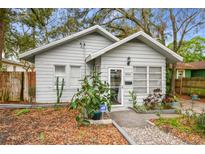 Charming single-story home with a well-maintained yard and neutral color palette at 8306 N 10Th St, Tampa, FL 33604