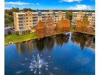Scenic view of the apartment complex with a fountain in the foreground, showcasing the waterfront setting at 960 Starkey Rd # 3406, Largo, FL 33771