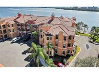 Stunning waterfront condo building with lush landscaping and access to beautiful bay views at 2773 Via Cipriani # 1330B, Clearwater, FL 33764