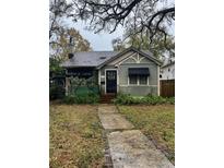 Charming single-story home with a welcoming entrance and quaint architectural details at 612 29Th N Ave, St Petersburg, FL 33704