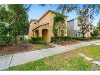 Charming two-story home featuring a welcoming entrance and well-maintained landscaping at 9033 Aspen Hollow Pl, Riverview, FL 33578