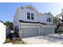 New construction townhome with two-car garage, and modern craftsman style at 3021 W Ballast Pt # 2, Tampa, FL 33611