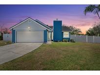 Charming single-story home featuring a two-car garage, well-manicured lawn, and freshly painted exterior at 3525 65Th Avenue E Cir, Sarasota, FL 34243