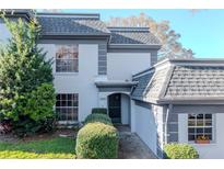 Charming home with landscaped front yard, showcasing the architectural details and inviting entrance at 1321 N Mcmullen Booth Rd # 1321, Clearwater, FL 33759