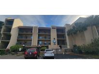 A charming apartment building with a well-maintained exterior and balconies in a desirable neighborhood at 90 S Highland Ave # 224, Tarpon Springs, FL 34689