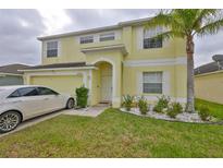 Charming two-story home boasts a well-manicured lawn, a two-car garage, and a welcoming entrance at 10730 Shady Preserve Dr, Riverview, FL 33579